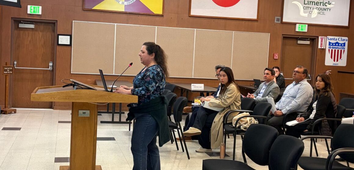 A person standing at a podium at a government meeting in Santa Clara, California