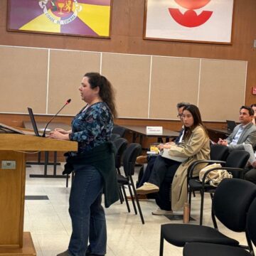 Santa Clara Vision Zero-3-10 A person standing at a podium at a government meeting in Santa Clara, California