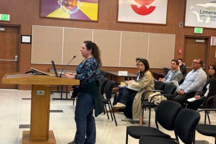 A person standing at a podium at a government meeting in Santa Clara, California