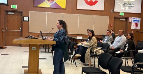 A person standing at a podium at a government meeting in Santa Clara, California