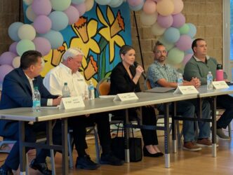 District 9-forum -4 people talking at an event