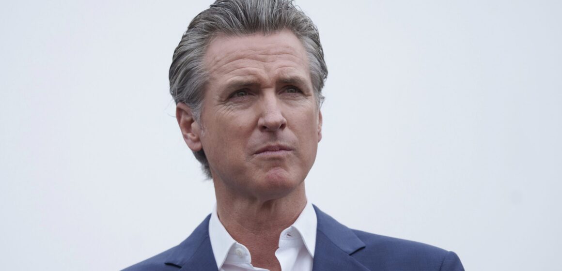 A man in a suit staring off into the distance