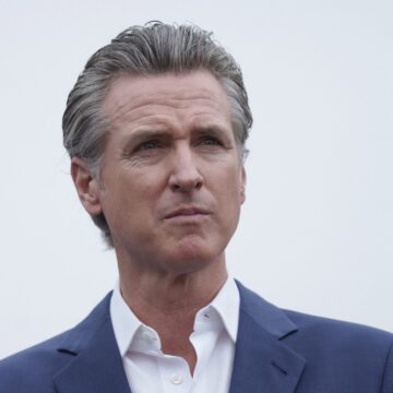 Gavin Newsom A man in a suit staring off into the distance