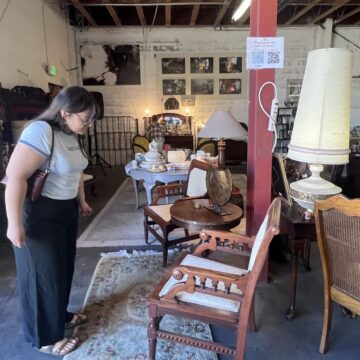 FOUND SJ A woman looking at furniture in a thrift shop in San Jose, California