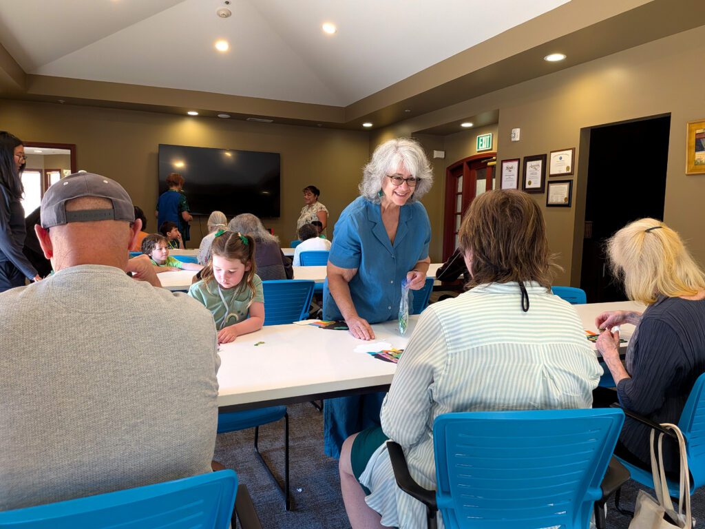 People at a table at an activity center in San Jose, California