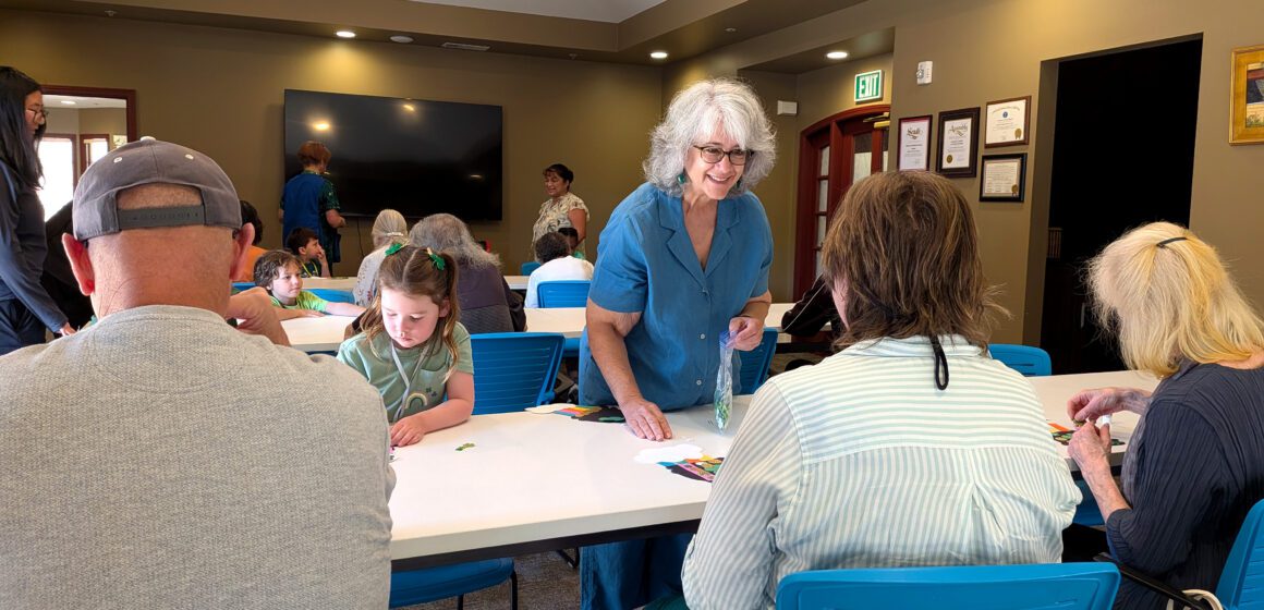 People at a table at an activity center in San Jose, California