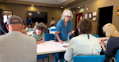 People at a table at an activity center in San Jose, California