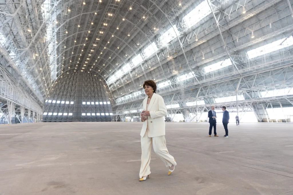 A woman walking inside an airplane hangar in Mountain View, California