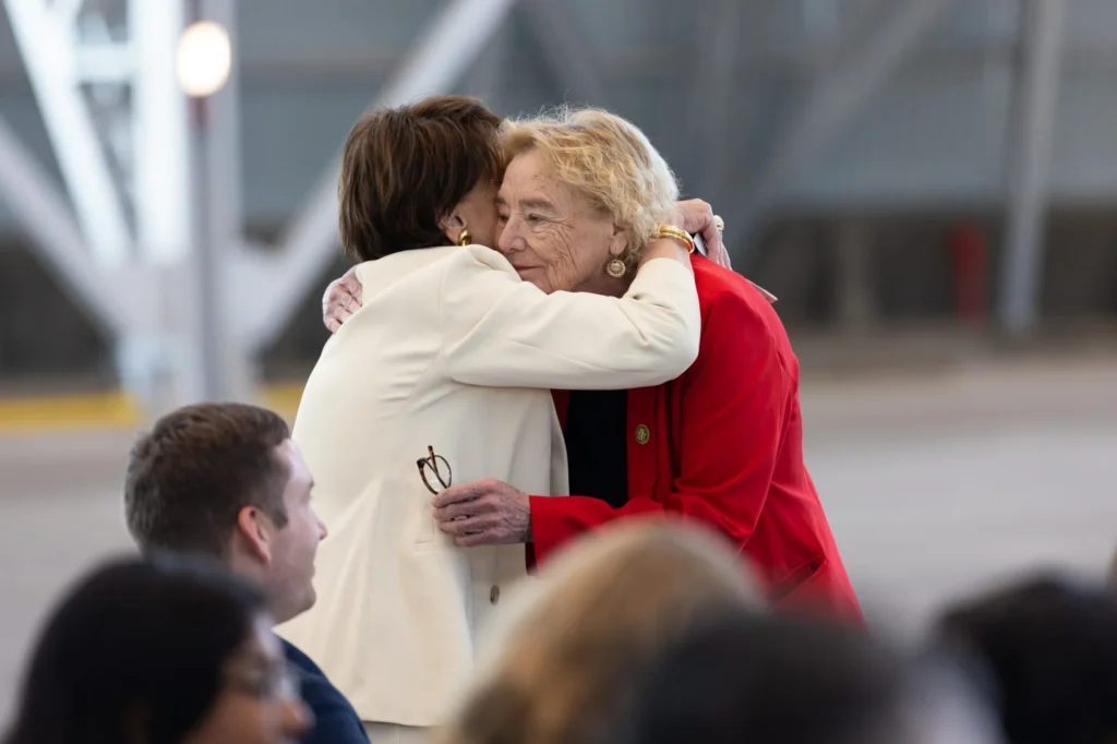 Two older women hugging