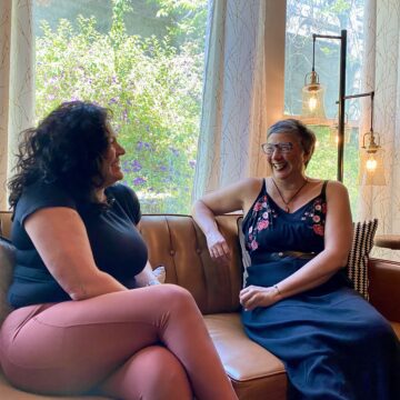 Two women sitting on a couch