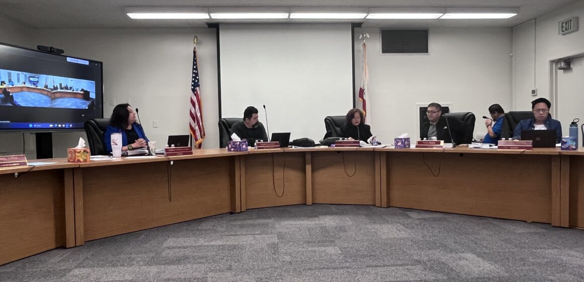 People sitting at a school board meeting in San Jose, California