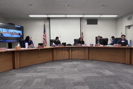 People sitting at a school board meeting in San Jose, California