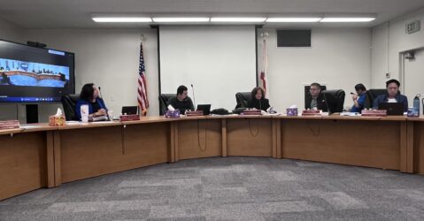 People sitting at a school board meeting in San Jose, California