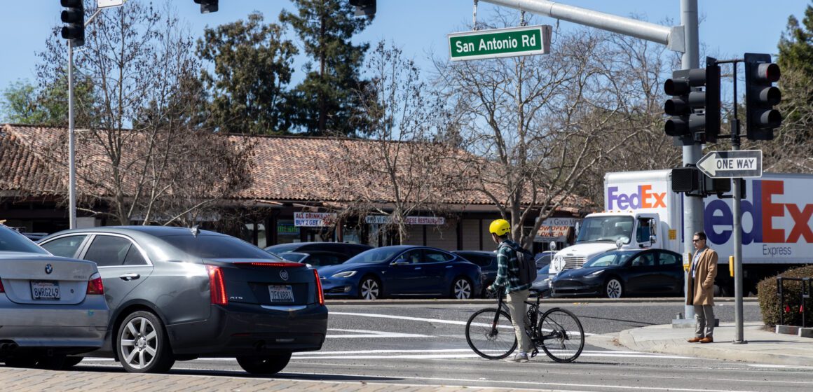 Cars and a cyclist at an intersection in Palo Alto, California