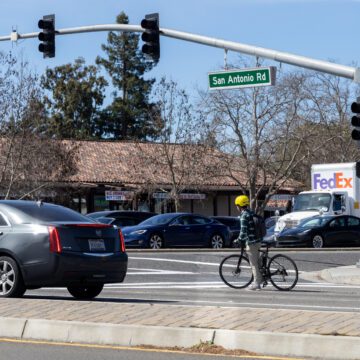 Cars and a cyclist at an intersection in Palo Alto, California