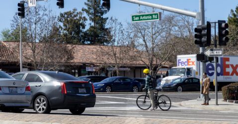 Cars and a cyclist at an intersection in Palo Alto, California