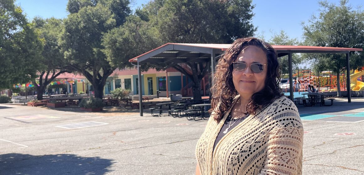 ESCUELA POPULAR FOLO A woman stands on the campus of a charter school in San Jose, California
