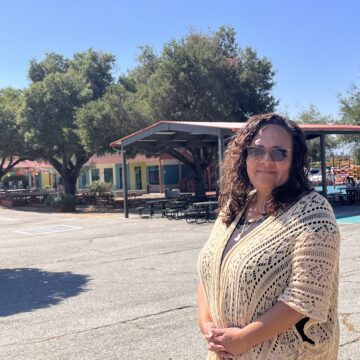 ESCUELA POPULAR FOLO A woman stands on the campus of a charter school in San Jose, California