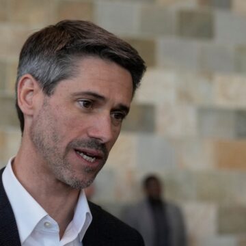 Matt Mahan A man in a black suit jacket and white collared shirt