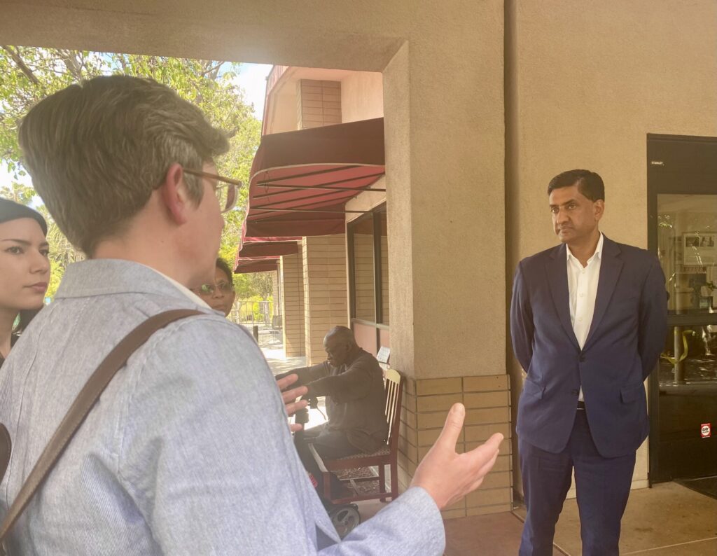 People talking to a Silicon Valley congressman outdoors