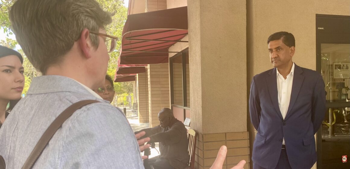 People talking to a Silicon Valley congressman outdoors