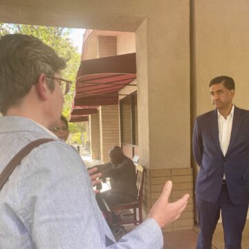 People talking to a Silicon Valley congressman outdoors