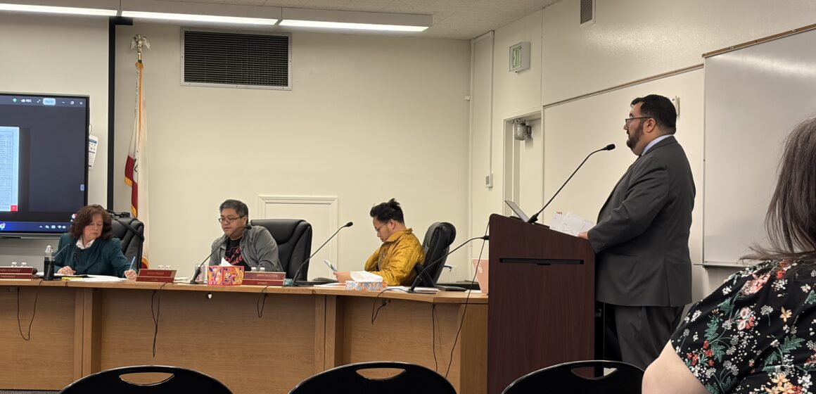 A man speaks at a podium at a school board meeting in San Jose, California