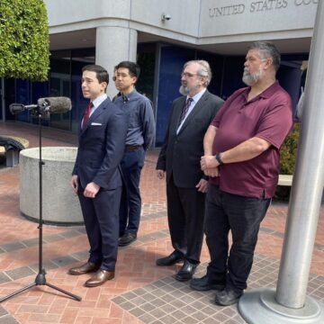 ALPR lawsuit A group speaks in front of a court building in San Jose, California
