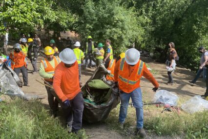 Workers clear a homeless encampment in San Jose