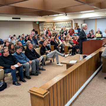 An audience at a City Council meeting in Campbell, California