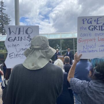 Rallygoers hold signs