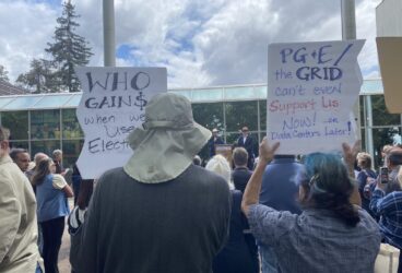 Rallygoers hold signs