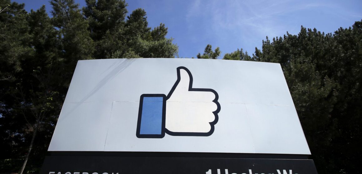 A sign with a thumbs up emoji