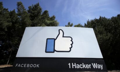 A sign with a thumbs up emoji