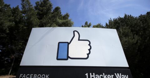 A sign with a thumbs up emoji