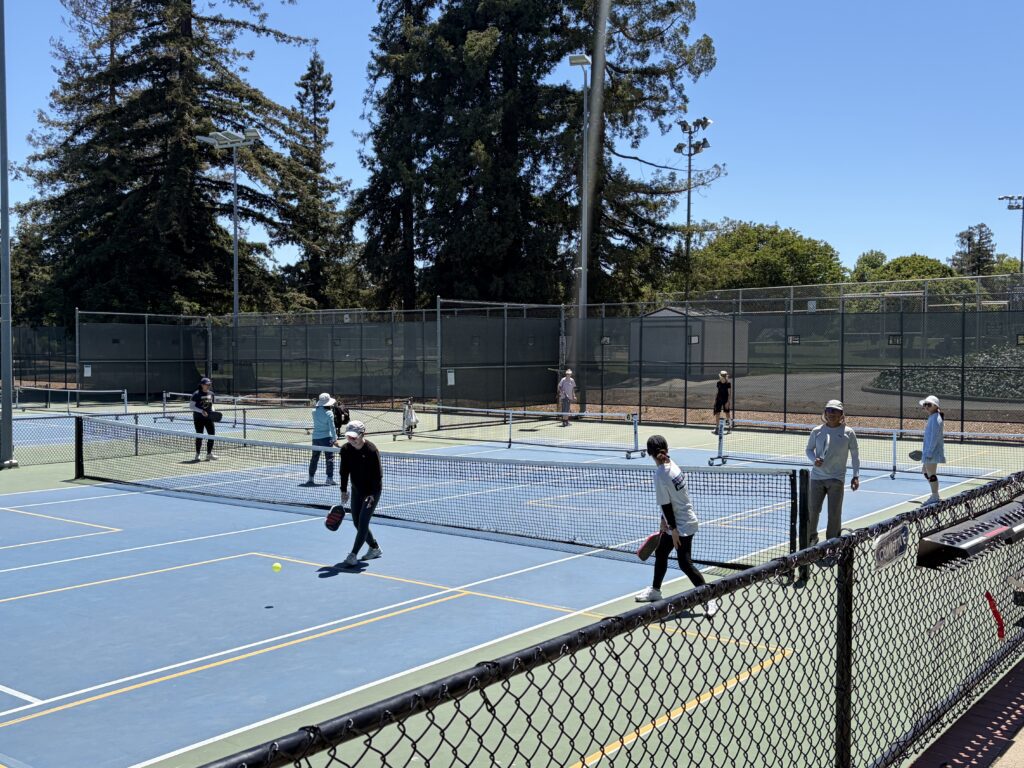 People playing pickleball on a court in Cupertino, California