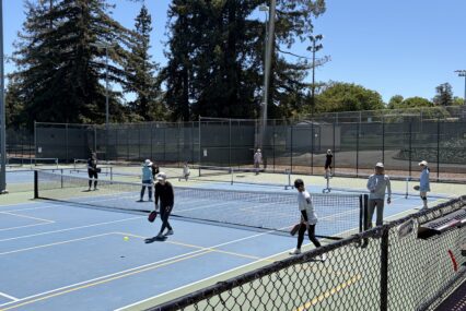 People playing pickleball on a court in Cupertino, California
