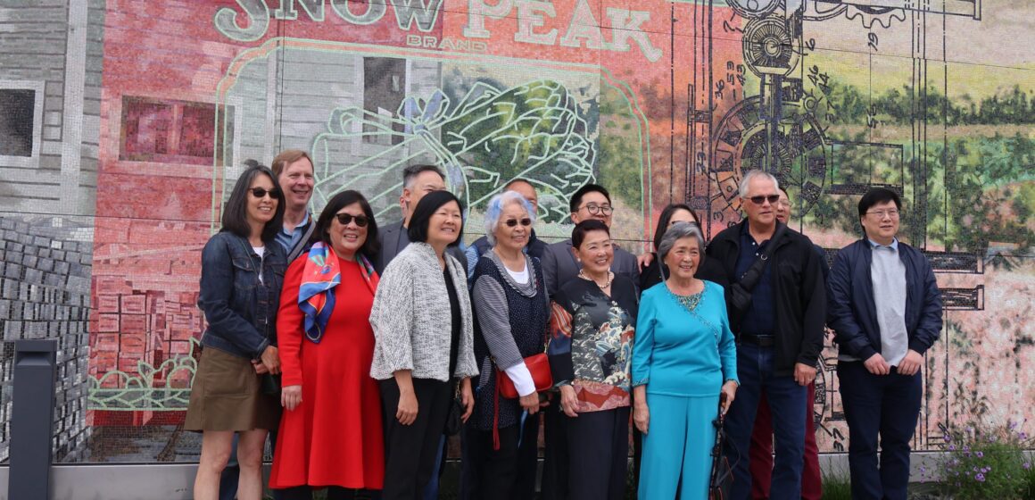 Palo Alto cannery A group of people standing in front of a mural in Palo Alto, California