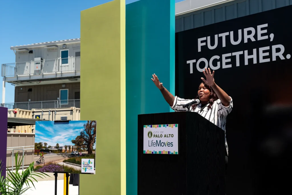 A woman speaks at a podium in Palo Alto, California
