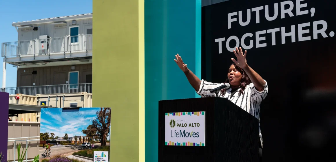 A woman speaks at a podium in Palo Alto, California