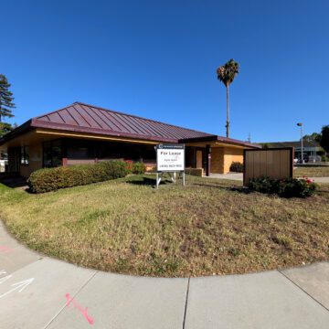 A closed restaurant with a real estate sign in front of it in Campbell, California