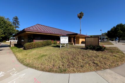 A closed restaurant with a real estate sign in front of it in Campbell, California