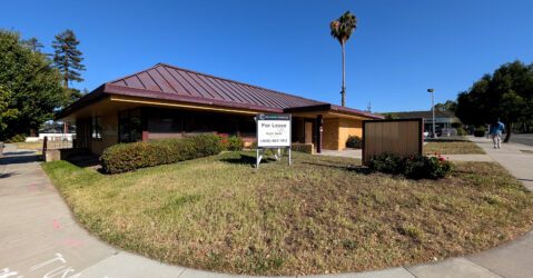 A closed restaurant with a real estate sign in front of it in Campbell, California
