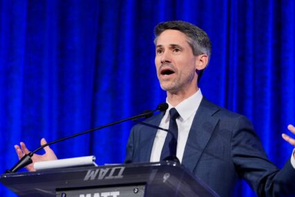 Man speaking at podium