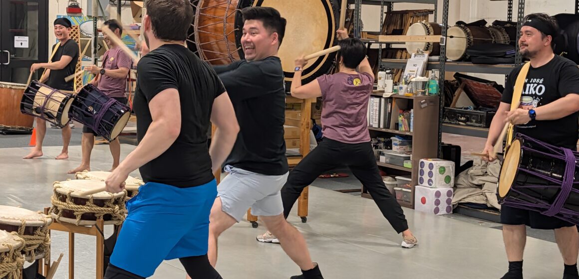 People practice drumming in a taiko music group in San Jose, California