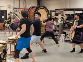 San Jose Taiko People practice drumming in a taiko music group in San Jose, California