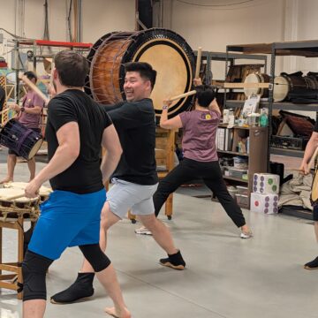 San Jose Taiko People practice drumming in a taiko music group in San Jose, California