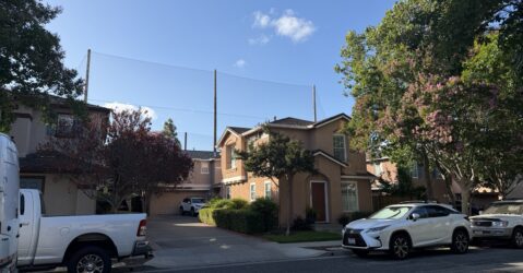 A home stands in front of a large net in San Jose, California