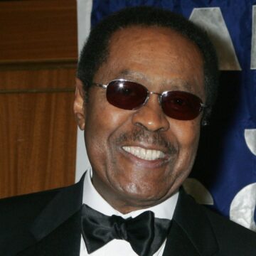 Biden Medal of Freedom A Black man wearing sunglasses smiles at the camera