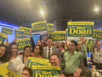 People with political signs cheering in San Jose, California